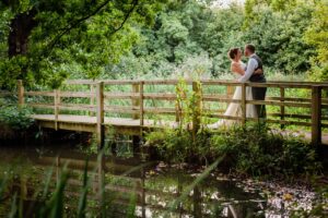 A wedding kiss at Michelham Priory, a historic house and barn wedding venue in East Sussex