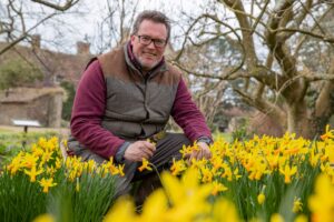 James Neal, Head Gardener at Michelham Priory with some of the 80,000 daffodils